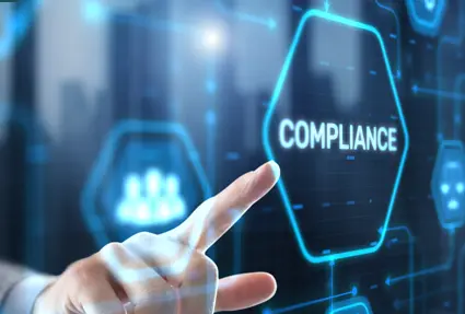 finger touching a screen with the word compliance