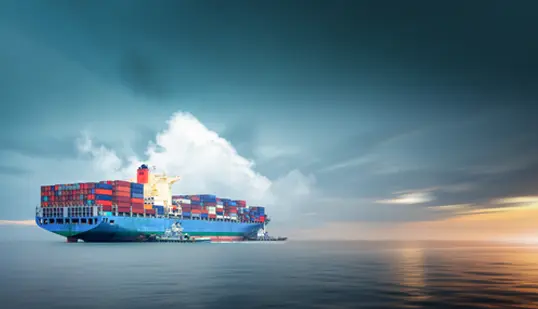 large boat carrying many shipping containers